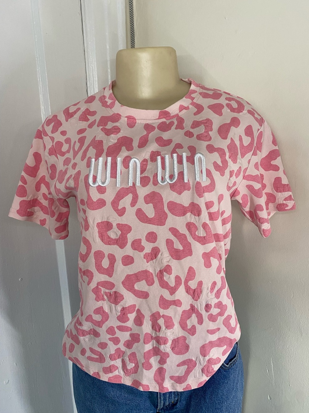 Pink leopard print t-shirt with white 'WIN WIN' text